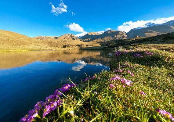 Damodar Kunda sacred lake surrounded by Himalayan peaks in Mustang, Nepal