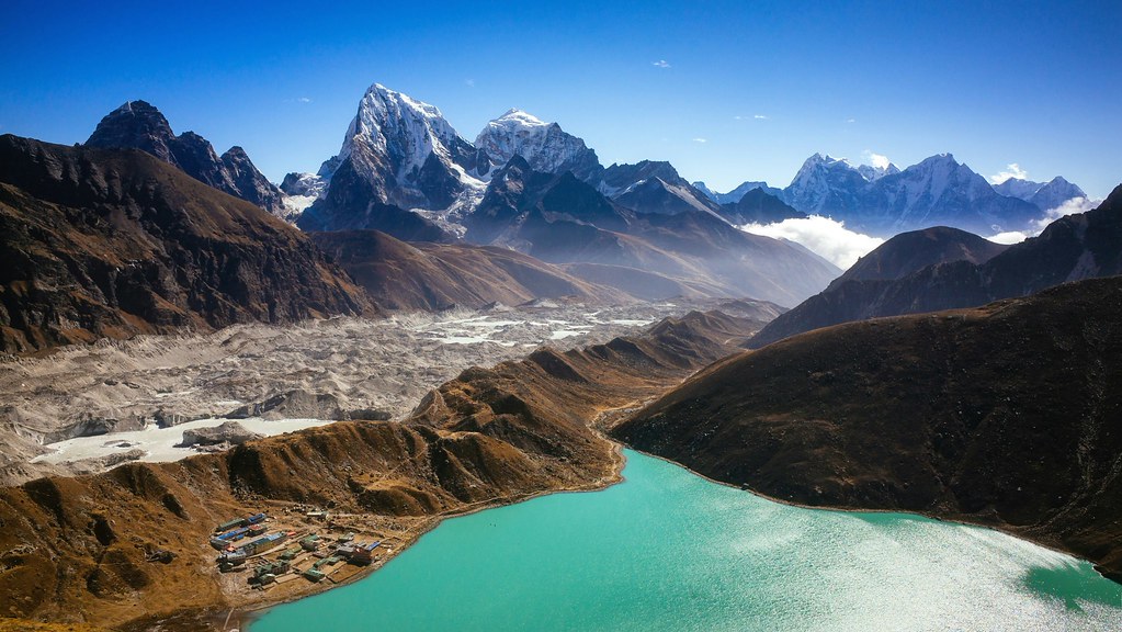Gokyo Lake surrounded by Himalayan mountains and Ngozumpa Glacier in Nepal