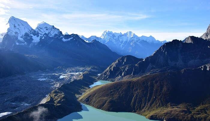 Khayer Lake surrounded by snow-capped mountains in the Annapurna region of Nepal